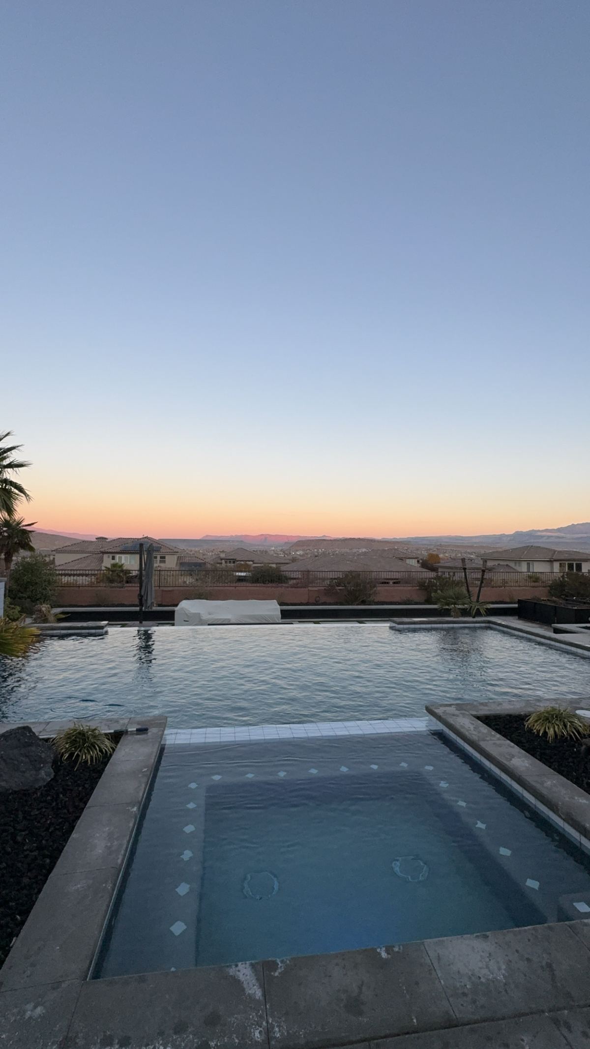 Clean pool and spa at dusk in St. George, Utah, maintained by Endless Summer Pool Service